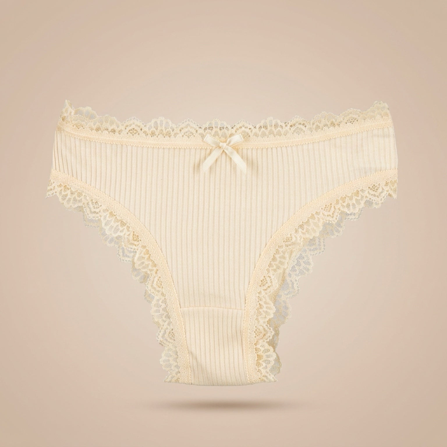 Women's cream cotton bikini panties with ribbed fabric, lace trim and bow detail, breathable everyday underwear front view